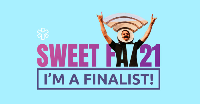 YunoJuno Sweet FA21 logo picturing a man with arms upraised wearing a WiFi head dress. With the words ‘I’m a finalist!’ written under ‘Sweet FA21’. Freelance copywriter category.