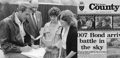 Freelance copywriter Alison Harmer with actor Roger Moore, a reporter from West Sussex County Times and a man from the Amberley Chalk Pits where A View to a Kill was filmed.