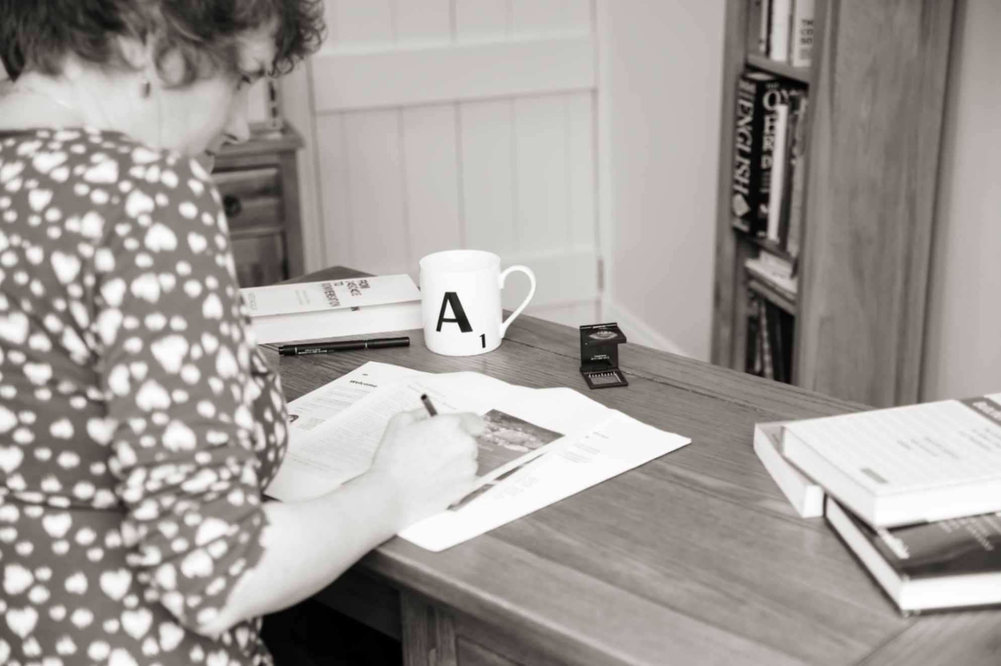 How long editing and proofreading takes: a proofreader makes amendments to a PDF on a desk.